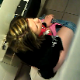 A guy video-records two women shitting & pissing in a public restroom at a truck stop. The view is from above the stall wall. Quite a risky endeavor! One scene features audible poop sounds and visible poop in the toilet bowl afterwards. About 5 minutes.